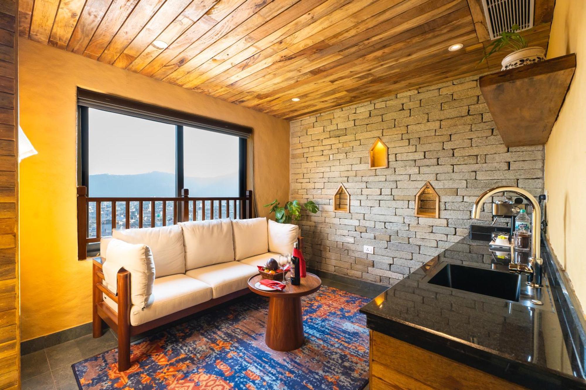 Bar Peepal Resort Pokhara Eksteriør bilde A living room in a typical apartment